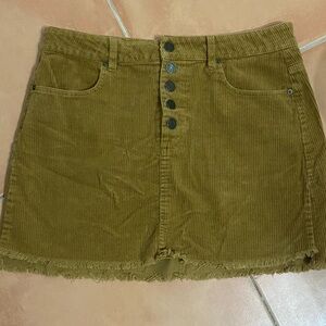Brown corduroy, button up, fringe bottom mini skirt.